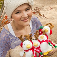 Child with a plush Aflac duck