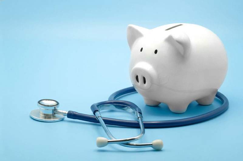 piggy bank and stethoscope