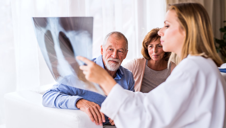 doctor discussing chest x-ray with patient.