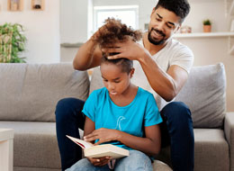 father doing daughters hair